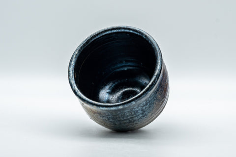 Japanese Teacup - Metallic Bronze Glazed Yunomi - 200ml - the cup tipped to show the blue oil-spot tenmoku glazed interior