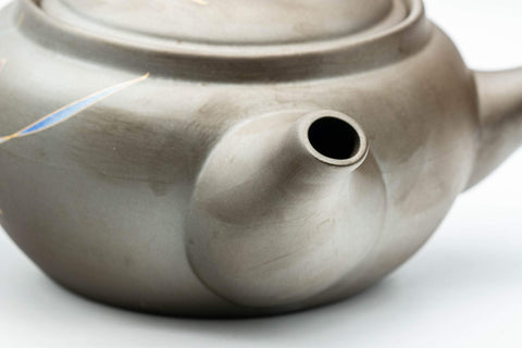 Tezumi — Orchid-decorated kyusu teapot, side view with the spout facing forward