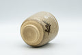 Japanese Teacup - Stoneware Tsutsu-gata Karatsu-yaki Yunomi - 120ml - tilted view showing the unglazed foot