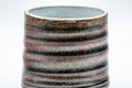 Japanese Teacup - Ribbed Tsutsu-gata Yunomi - 130ml - closeup of the ribbed red and black glazed exterior