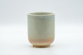 Japanese Teacup - Tsutsu-gata Hagi-yaki Yunomi - front view showing the grey glaze fading to warm pink at the base