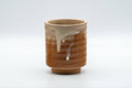 Japanese Teacup - Drip-Glazed Hagi-yaki Yunomi - 170ml - front view of the cylindrical teacup with a white drip glaze over crazed beige and orange