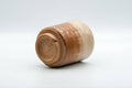Japanese Teacup - Drip-Glazed Hagi-yaki Yunomi - 170ml - the teacup resting on its side showing the foot and underside