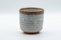 Japanese Teacup - White Drip-Glazed Hagi-yaki Yunomi - 175ml - front view of the white drip-glazed cup with a brown-glazed lip