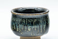 Japanese Teacup - Dojimari-gata Tenmoku Nagashi Glazed Guinomi - 40ml - closeup of the flowing tenmoku nagashi glaze