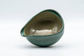 Tezumi — Japanese Katakuchi - Blue-green Agano-yaki Water Cooler  - 100ml — tipped to show the interior