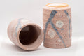 Japanese Teacups - Pair of Meoto Shino Glazed Tsutsu-gata Yunomi - 180ml - one cup tipped to show the interior beside an upright cup