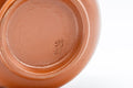 Japanese Teacups - Pair of Plum Blossoms Tsutsu-gata Tokoname-yaki Yunomi - 100ml - closeup of the underside showing the brick-red Tokoname clay foot