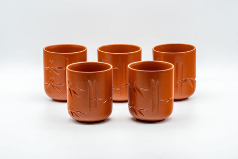 Japanese Teacup - Bamboo Engraved Tokoname-yaki Yunomi - front view of several brick-red Tokoname-yaki cups grouped together