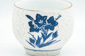 Japanese Teacups - Pair of White and Blue Floral Yunomi - 150ml - closeup of the blue-and-white floral painting on the exterior