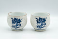 Japanese Teacups - Pair of White and Blue Floral Yunomi - 150ml - front view of the pair of white teacups with blue-and-white floral painting