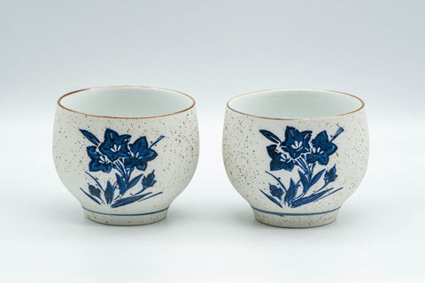 Japanese Teacups - Pair of White and Blue Floral Yunomi - 150ml - front view of the pair of white teacups with blue-and-white floral painting
