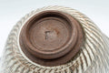 Tezumi — Japanese Teacup - Engraved Floral Spiraling Kyo-yaki Yunomi  - 130ml — closeup of the glaze