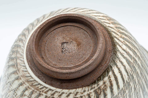 Tezumi — Japanese Teacup - Engraved Floral Spiraling Kyo-yaki Yunomi  - 130ml — closeup of the glaze