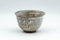 Tezumi — Japanese Teacup - Engraved Floral Spiraling Kyo-yaki Yunomi  - 130ml — front view from another angle
