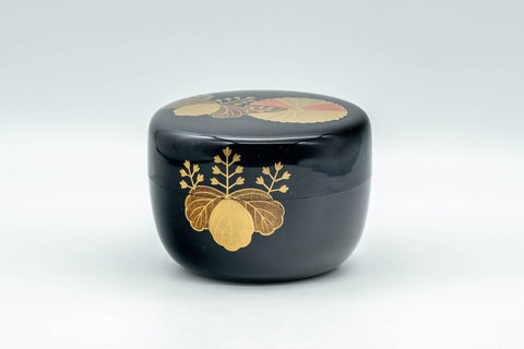Japanese Natsume - Hira-Natsume Chrysanthemum Lacquer Matcha Tea Caddy - 100ml - front view of the black lacquer caddy with gold chrysanthemum motif