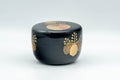 Japanese Natsume - Hira-Natsume Chrysanthemum Lacquer Matcha Tea Caddy - 100ml - angled view showing the gold leaf chrysanthemum decoration