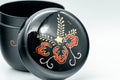 Japanese Natsume - Floral Lacquer Matcha Tea Caddy - 110ml - top-down closeup of the lid showing the red and gold floral motif