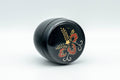 Japanese Natsume - Floral Lacquer Matcha Tea Caddy - 110ml - angled view showing the hand-painted red and gold floral design
