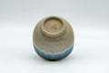 Japanese Teacup - Turquoise Glazed Agano-yaki Yunomi - 90ml - the teacup resting on its side showing the foot and underside