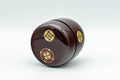 Japanese Natsume Matcha Caddy - Tea Canister - 七宝 Lacquer Natsume - 120ml - angled view showing the gold shippo motif