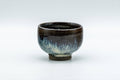 Japanese Teacup - Tenmoku Nagashi Glazed Guinomi - 50ml - front view of the rounded black tenmoku-glazed cup