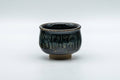 Japanese Teacup - Dojimari-gata Tenmoku Nagashi Glazed Guinomi - 40ml - front view of the small black tenmoku-glazed cup