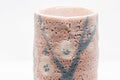 Japanese Teacups - Pair of Meoto Shino Glazed Tsutsu-gata Yunomi - 180ml - closeup of a cup showing the textured pink shino glaze and blue branch
