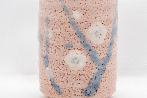 Japanese Teacups - Pair of Meoto Shino Glazed Tsutsu-gata Yunomi - 180ml - closeup of the plum blossom decoration on the textured glaze