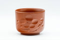 Japanese Teacups - Pair of Plum Blossoms Tsutsu-gata Tokoname-yaki Yunomi - 100ml - front view of one cup showing the engraved plum blossom motif