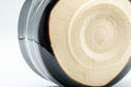Tezumi — Japanese Matcha Bowl - Jet Black Hantsutsu-gata Chawan - 450ml — closeup of the glaze