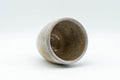 Japanese Teacup - Sadatsugu Shinjo, Sukeemon Kiln - Beige Glazed Hagi-yaki Yunomi - 150ml - the cup tilted to show the glazed interior