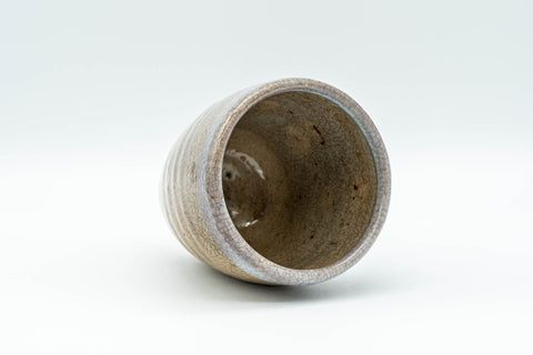 Japanese Teacup - Sadatsugu Shinjo, Sukeemon Kiln - Beige Glazed Hagi-yaki Yunomi - 150ml - the cup tilted to show the glazed interior