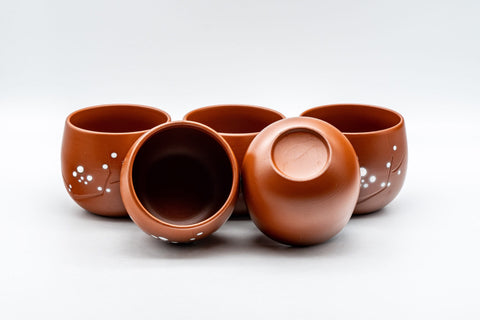 Japanese Teacup - Plum Blossoms Tokoname-yaki Yunomi - 125ml - angled view with teacups tipped to show the interiors