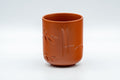Japanese Teacup - Bamboo Engraved Tokoname-yaki Yunomi - front view of a single red cup