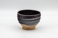 Japanese Teacup - Purple Glazed Spiral Yunomi - 100ml - front view of the dark matte purple spiral-glazed teacup with an exposed clay foot