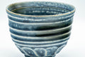 Tezumi — Japanese Matcha Bowl - Blue Geometric Spiraling Chawan - 450ml — tipped to show the interior