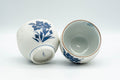 Japanese Teacups - Pair of White and Blue Floral Yunomi - 150ml - closeup of one teacup tipped on its side showing the interior