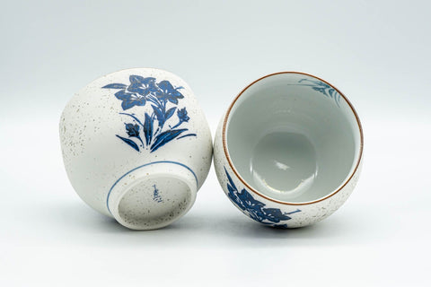 Japanese Teacups - Pair of White and Blue Floral Yunomi - 150ml - closeup of one teacup tipped on its side showing the interior