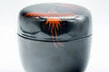 Japanese Natsume - Egrets Lacquer Matcha Tea Caddy - 100ml - the closed caddy showing the red egret decoration on the body