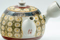 Japanese Tea Set - Kutani-yaki Debeso Kyusu Teapot with 1 Yunomi Teacup - closeup of the yellow glaze and hand-painted chrysanthemum aka-e kinran-de design