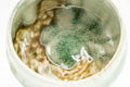 Tezumi — Japanese Matcha Bowl - Green Ash Drip-Glazed Hantsutsu-gata Chawan - 400ml — inverted showing the foot ring