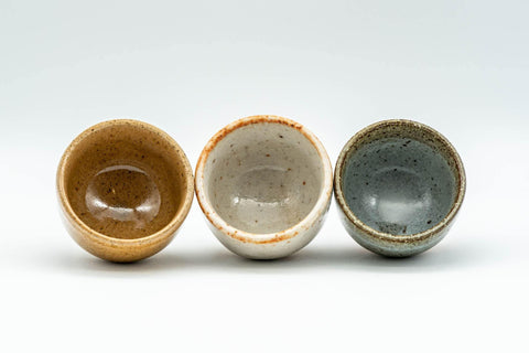 Tezumi — Japanese Teacups - Set of 3 Orange, White, and Grey-Green Guinomi - 35ml — front view from another angle