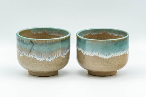 Japanese Teacups - Pair of Drip-Glazed Agano-yaki Yunomi - 140ml - front view of the matching pair of beige teacups with turquoise drip glaze