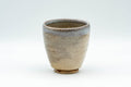 Japanese Teacup - Sadatsugu Shinjo, Sukeemon Kiln - Beige Glazed Hagi-yaki Yunomi - 150ml - front view of the tall beige Hagi-yaki teacup