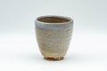 Japanese Teacup - Sadatsugu Shinjo, Sukeemon Kiln - Beige Glazed Hagi-yaki Yunomi - 150ml - angled view of the crazed beige glaze
