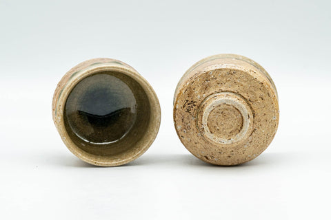 Japanese Teacups - Pair of Shigaraki-yaki Guinomi - 60ml - the pair tilted to show the green-glazed rims and unglazed feet
