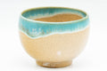 Japanese Teacup - 上野焼 Gold-flecked Agano-yaki Yunomi - 80ml - closeup of the turquoise enamel drip over the beige stoneware
