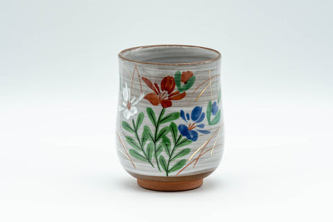 Japanese Teacup - Floral Brush Glazed Yunomi - 150ml - front view showing the red and blue flowers on the white brush glaze