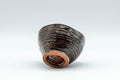 Tezumi — Japanese Teacup - Wabi-Sabi Guinomi - 50ml — tipped to show the interior